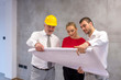 © Drpixel - Architect showing plan of new apartment to young couple