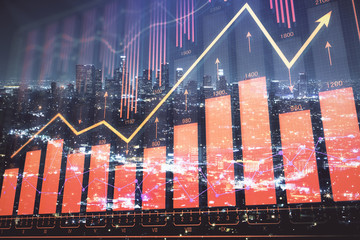 Financial graph on night city scape with tall buildings background multi exposure. Analysis concept.