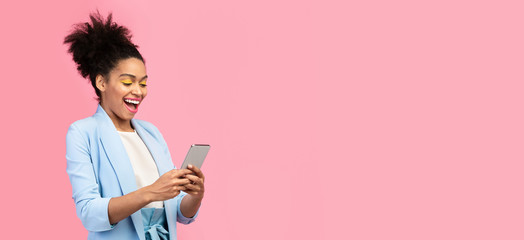 Afro girl using her mobile phone at studio