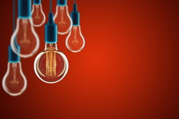 Wall Mural - Idea and leadership concept - bulbs on the red background