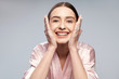 © Yakobchuk Olena - Cheerful pretty girl washing face with foaming cleanser