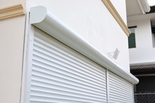White Roller Shutter Door Closed Security In Modern House