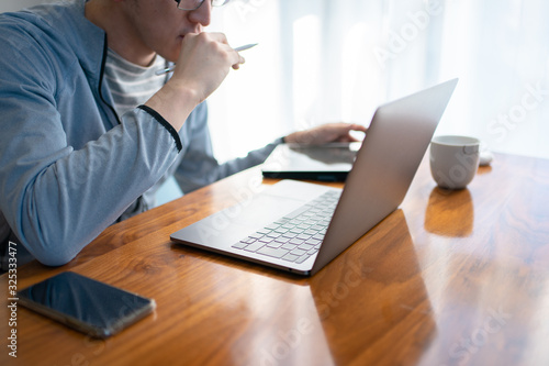 部屋着でリモートワークするメガネの会社員男性 Buy This Stock Photo And Explore Similar Images At Adobe Stock Adobe Stock