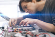 © Mihail - student making measurement and costruct the circuit board with engineer equipment, studying process