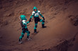 Two Astronauts Wearing Space Suits Holding Hands on Mars/ Red Planet. Love in Space Travel, Exploration and Colonization Concept.