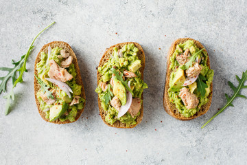 Wall Mural - Avocado toast with tuna and arugula