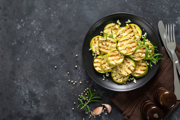 Sticker - Grilled zucchini, courgette with garlic and rosemary on plate, top view