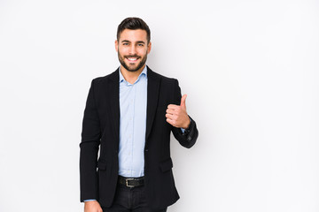 Young caucasian business man against a white background isolated smiling and raising thumb up