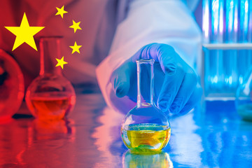 Chemical concept. Glass laboratory utensils on the table. Empty flasks and test tubes on a blue background. Equipment for chemical laboratories. Conducting experiments in the field of chemistry.