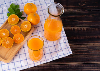 fresh squeezed orange juice on wood table