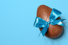 Chocolate Easter Egg With Blue Ribbon Bow