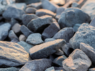 stones on the shore closeup. Stock photo. Beautiful rocks on the Sunset. Background bright colors