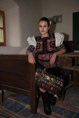 Beautiful slovak woman in traditional costume. Slovak folklore.