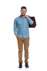 Poster - Happy casual man laughing while holding briefcase