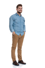 Poster - Happy casual man smiling with his hands in his pockets