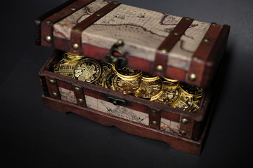 Treasure chest with investment bullion gold coins