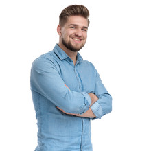 Positive Casual Man Holding His Hand Crossed And Smiling