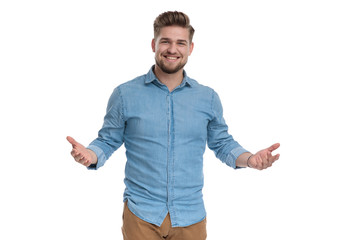 Canvas Print - Cheerful casual man laughing and inviting