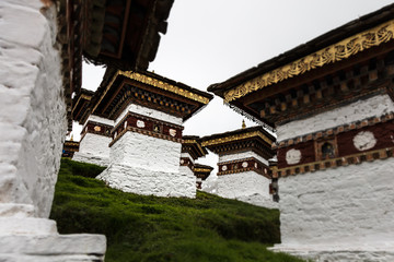 Druk Wangyal, Bhutan, 108 chorten or stupas, a memorial in honor of the Bhutanese soldiers at the Dochula Pass on a cloudy foggy day in altitude of 3000 meters. A bhutanese sanctuary