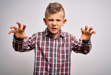 Sticker - Young little caucasian kid with blue eyes wearing elegant shirt standing over isolated background smiling funny doing claw gesture as cat, aggressive and sexy expression