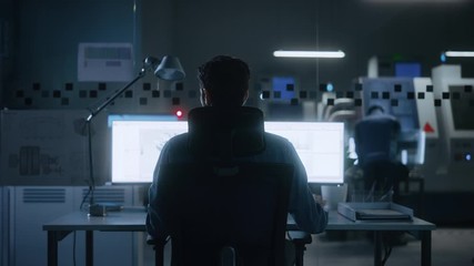 Poster - Industrial Engineer Solving Problems, Working on a Personal Computer, Two Monitor Screens Show CAD Software with 3D Prototype of Eco-Friendly Electric Engine Concept. Back View Zoom in
