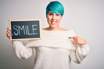 Sticker - Young woman with blue fashion hair holding blackboard with smile message with surprise face pointing finger to himself