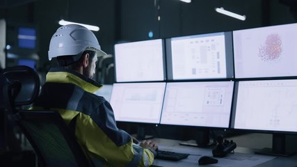 Leinwandbilder - Industry 4.0 Modern Factory: Facility Operator Controls Workshop Production Line, Uses Computer with Screens Showing Complex UI of Machine Operation Processes, Controllers, Machinery Blueprints