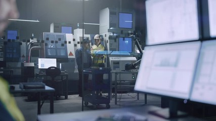Leinwandbilder - Workshop: Specialists Programming Robot Arm for Industrial Production Line. Factory Office: Operator Controls Workshop Assembly Line, Uses Computer with Screens Showing Machine Operation UI 