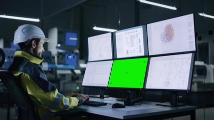 Leinwandbilder - Industry 4.0 Modern Factory: Handsome Male Operator Controls Facility, Uses Computer with Multiple Screens Including: Green Screen / Chroma Key, AI Concept, Machine Learning UI
