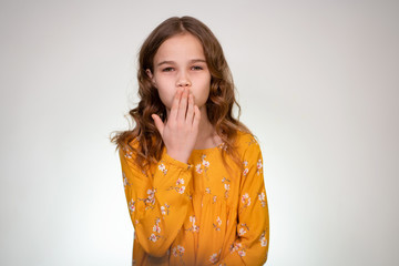 a kiss from a teen girl in white background, hand
