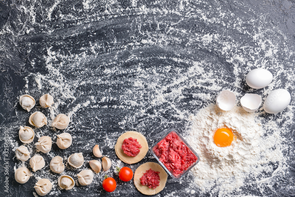 Making of tasty dumplings on dark background