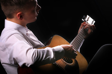 Wall Mural - Young men playing the guitar