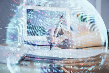 International business hud over woman's hands writing background. Concept of hard work. Double exposure