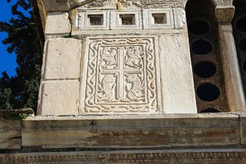 Carved stones decorate the exterior wall of an old Christian orthodox church in Athens, Greece