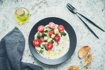 Wall Mural - Fresh salad with cucumbers and tomatoes