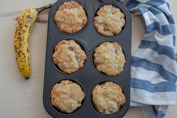 Wall Mural - Home made banana muffins on the wooden table