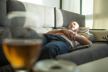Hombre Tomando La Siesta En El Sofa, Despues De Tomar Cerveza