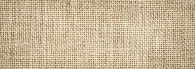 Wall Mural - Rough hessian background with flecks of varying colors of beige and brown. with copy space. office desk concept, Hessian sackcloth burlap woven texture background.