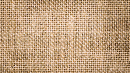 Wall Mural - Rough hessian background with flecks of varying colors of beige and brown. with copy space. office desk concept, Hessian sackcloth burlap woven texture background.