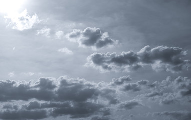 Wall Mural - dark dramatic sky and clouds. background for death and sad concept. gray sky and fluffy white clouds