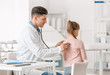 © Pixel-Shot - Pediatrician examining little girl in clinic