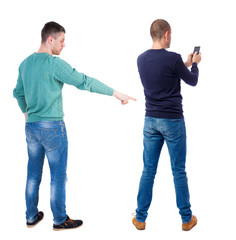 Poster - Back view of two man in sweater with mobile phone.