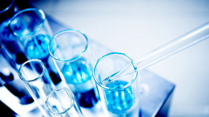 drop blue liquid and droplet laboratory for science test , lab chemical study and medical concept ba
