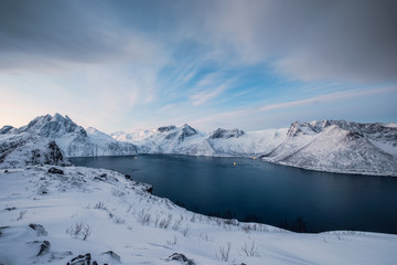 Wall Mural - Sunrise on snowy Segla peak on Senja island in winter