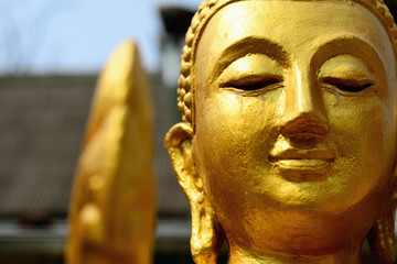 Closeup detail of golden buddha statue