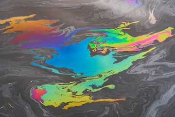  Pollution from a colored oil stain on the water surface