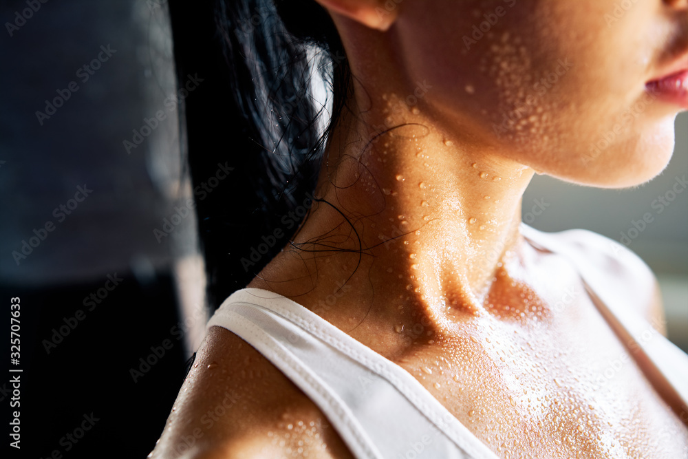 Close up shoulders and neck of sporty girl in drop of sweat on skin after workout - obrazy, fototapety, plakaty 