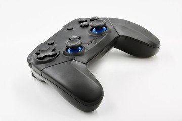 Gamepad on a white background. Game Joystick. Closeup, selective focus