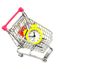 Yellow alarm clock in a shopping trolley 2