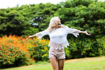 Freedome Happy young beautiful Woman Enjoying life at Nature park concept.